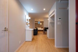 a hallway with a kitchen and a living room at Hotel AZUMA SEE in Tokyo +37 photos