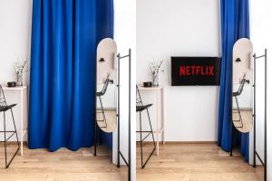 Televízia a/alebo spoločenská miestnosť v ubytovaní TurnKey I Main Bus Station Apartments