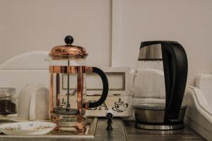 a coffee maker sitting on a kitchen counter at Linkview House in Frankfort