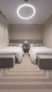 Voodi või voodid majutusasutuse The Key - Luxury Apartment toas
