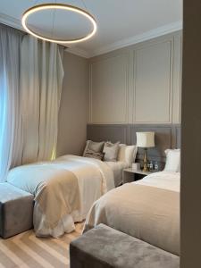 Voodi või voodid majutusasutuse The Key - Luxury Apartment toas