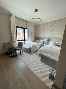Voodi või voodid majutusasutuse The Key - Luxury Apartment toas