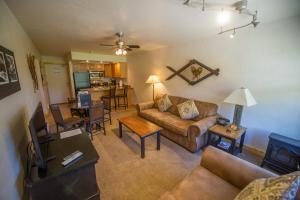 a living room with a couch and a table at Located At Base Of The Magnificent Mt Quandary in Breckenridge