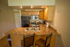 a kitchen with a sink and a counter top at Located At Base Of The Magnificent Mt Quandary in Breckenridge