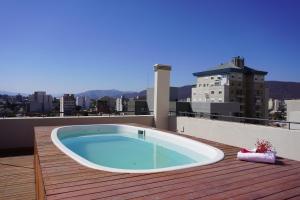 a hot tub on the roof of a building at M&C Apart in Salta