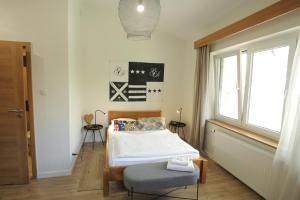 Posteľ alebo postele v izbe v ubytovaní Hotel Na Skarpie - Charzykowy