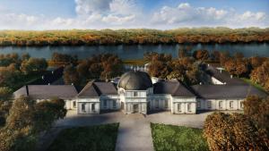 uma vista aérea de uma mansão sobre um lago em Jurtafarm Ráckeve - a nomád luxus em Ráckeve