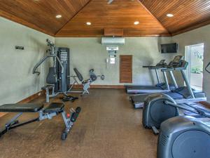 a gym with several treadmills and machines in a room at 5506 Hampton Place South in Hilton Head Island