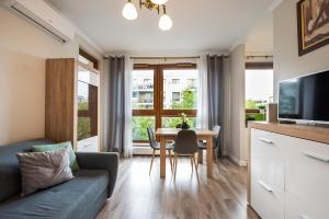Televízia a/alebo spoločenská miestnosť v ubytovaní Prestige Verdant Apartment