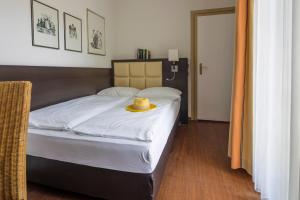 Postel nebo postele na pokoji v ubytování Hotel Minerva