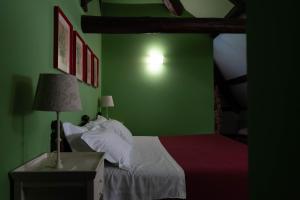 Postel nebo postele na pokoji v ubytování Hotel Villa Dorata