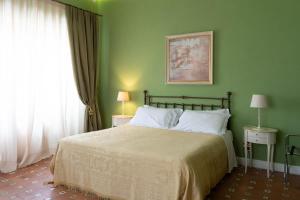Postel nebo postele na pokoji v ubytování Hotel Villa Dorata