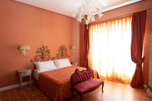 Postel nebo postele na pokoji v ubytování Hotel Villa Dorata