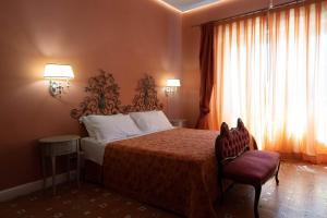 Postel nebo postele na pokoji v ubytování Hotel Villa Dorata