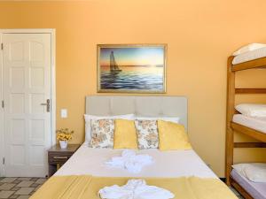 Cama ou camas em um quarto em Pousada do Luar Cabo Frio