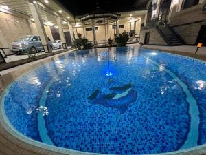 Bazén v ubytování HOTEL DaMir nebo v jeho okolí