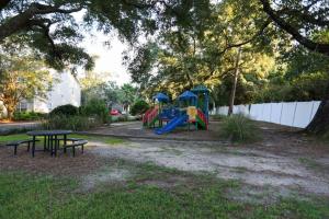 a park with a playground with a table and benches at Lux 2BD 2BA minutes from the water in Pensacola