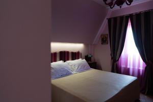 Postel nebo postele na pokoji v ubytování Hotel Villa Dorata