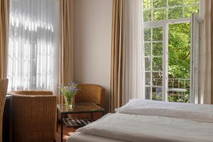 Postel nebo postele na pokoji v ubytování Hotel Minerva