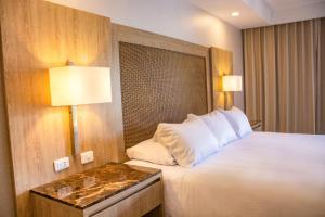 Postel nebo postele na pokoji v ubytování Hotel Campestre las Camelias