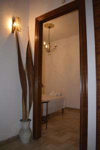 a room with a bedroom with a bed and a mirror at Casa Vacanza Pietro e Nina in Lecce +13 photos