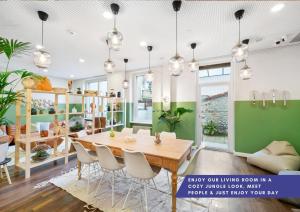 a dining room with a table and chairs at Becozy Self Check-in Hotel Basel an der Messe in Basel