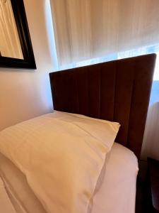 Ένα ή περισσότερα κρεβάτια σε δωμάτιο στο Apartments Wile Süd