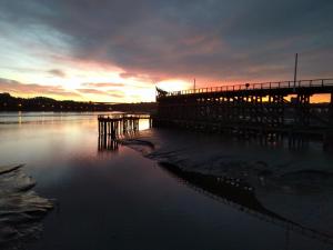 a pier on a body of water at sunset at Riverside home. 3 bedroom. Free parking. 10 mins to Newcastle City Centre in Dunston