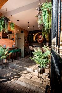 a patio with plants and a table in a restaurant at Lace Market Hotel in Nottingham