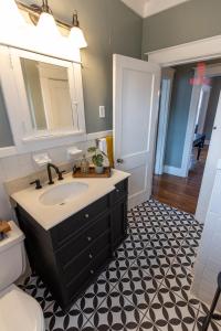 a bathroom with a sink and a toilet at Historic Revival 2BR Midtown Memphis Fast Wifi Free Parking Yes Pets in Memphis
