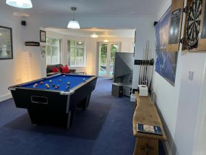 a living room with a pool table and a tv at Beautiful 2 Bed Apt with Hot Tub in Blaydon Burn in Blaydon