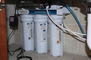 four white heaters are lined up under a wall at San Angel Villas in San Antonio