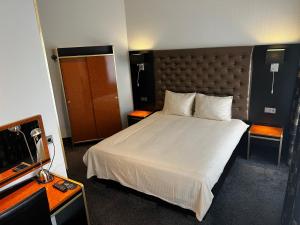 Postel nebo postele na pokoji v ubytování Hotel Le Beau Rivage