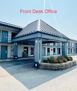 a front desk office building with a gazebo at Rogers Inn in Rogers