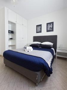 Posteľ alebo postele v izbe v ubytovaní MC Apartments