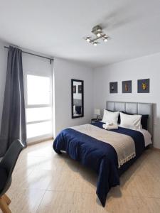 Posteľ alebo postele v izbe v ubytovaní MC Apartments