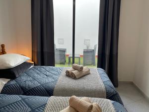 Posteľ alebo postele v izbe v ubytovaní MC Apartments