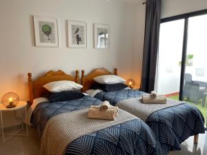 Posteľ alebo postele v izbe v ubytovaní MC Apartments