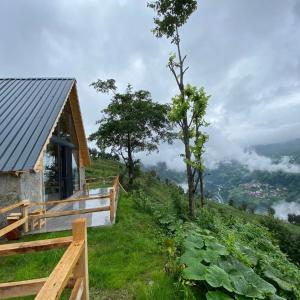 a cabin on the side of a hill with a view at ONASUITBUNGALOW in Rize