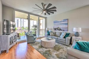 a living room with a couch and a tv at Naples Escape in Regatta with Resort Amenities! in Naples