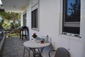 A balcony or terrace at happy2 Dafni Family home near Athens, airport, ports