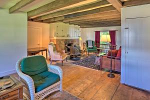 a living room with a couch and a chair at Charlemont Retreat on Chickley River with EV Charger in Charlemont