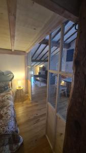 a room with a bed and a view of a living room at Loft Breton De Los Herreros in Logroño