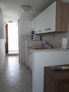 Kuchyň nebo kuchyňský kout v ubytování Apartman MAJA