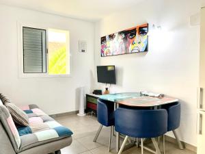 a room with a desk and a table and a couch at Casa di Luca EL VERGEL by luca properties gran canaria in Puerto Rico de Gran Canaria
