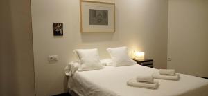 Ένα ή περισσότερα κρεβάτια σε δωμάτιο στο Apartamentos Arquitas