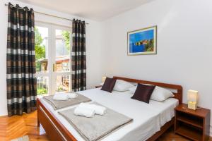 Postel nebo postele na pokoji v ubytování Ambience Dubrovnik
