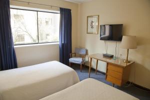 TV a/nebo společenská místnost v ubytování Hotel Santa Lucia