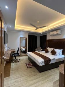 Ένα ή περισσότερα κρεβάτια σε δωμάτιο στο Mohammadia Guest House