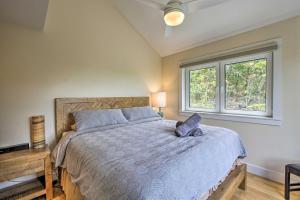 a bedroom with a large bed and a window at The Glabin Garrison Gem with Deck and Fire Pit! in Garrison
